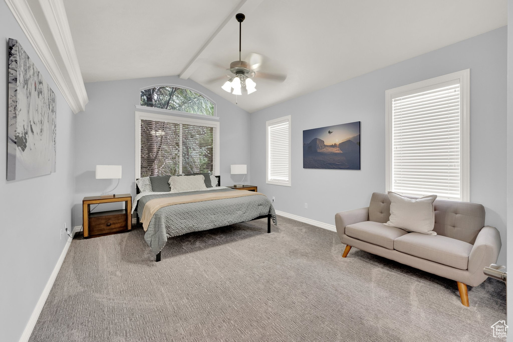 Bedroom featuring carpet flooring, lofted ceiling, baseboards, and a ceiling fan