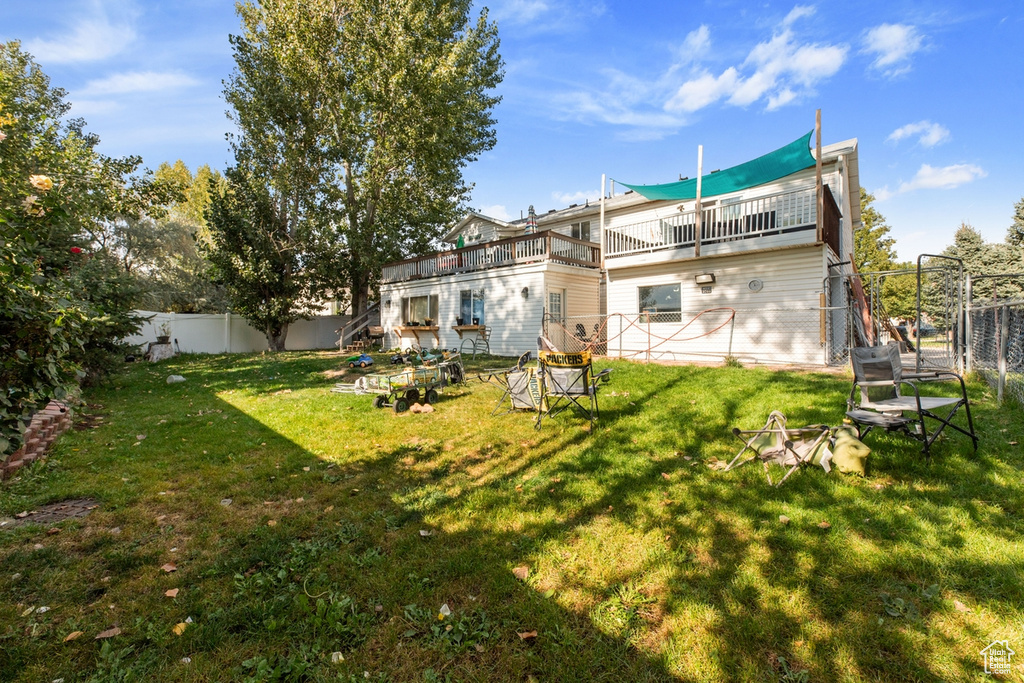 Rear view of property featuring a deck