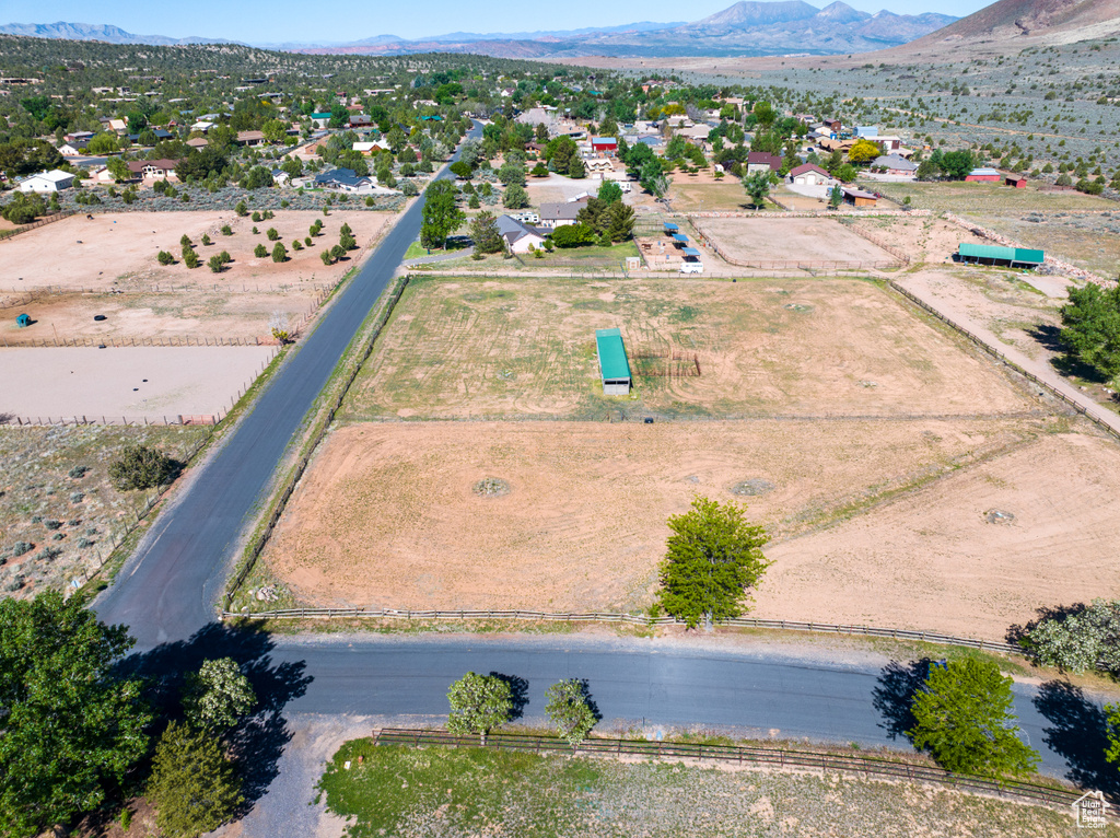 Aerial view of property and surrounding area with mountains