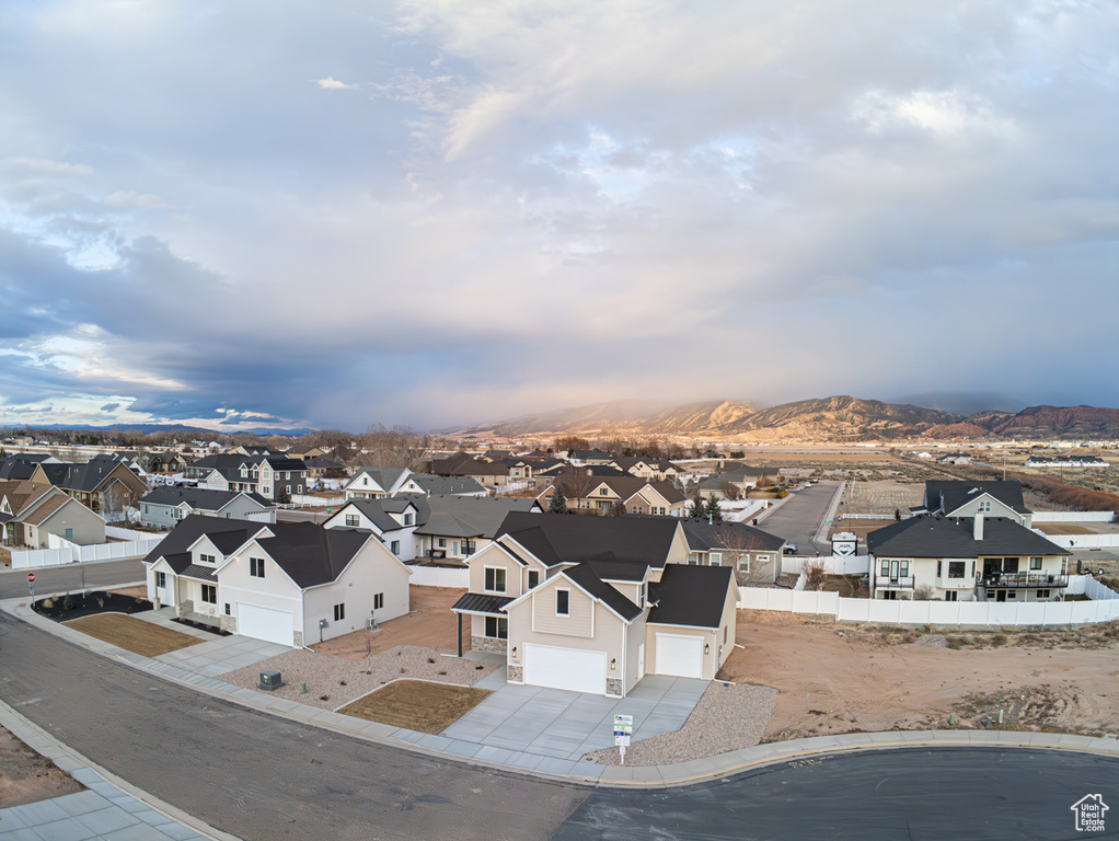 Aerial view of residential area with a mountainous background