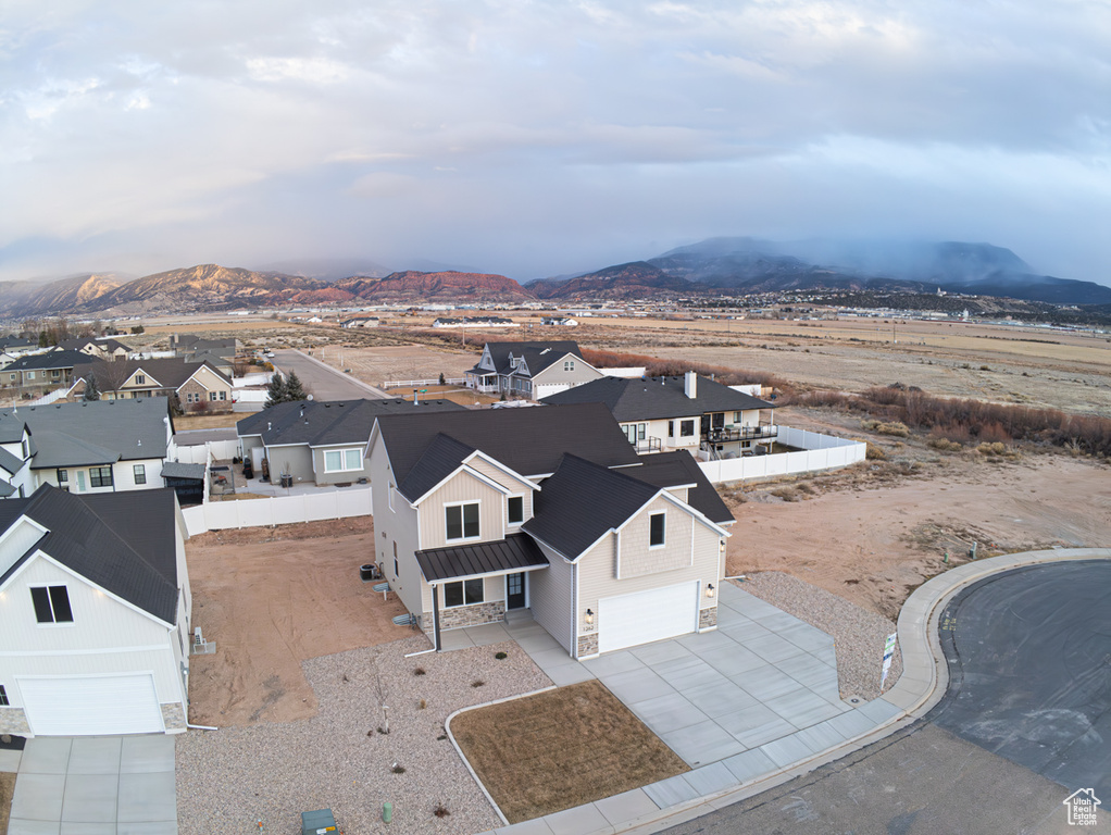Aerial perspective of suburban area featuring a mountain backdrop