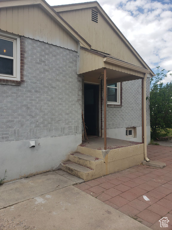 Property entrance with brick siding