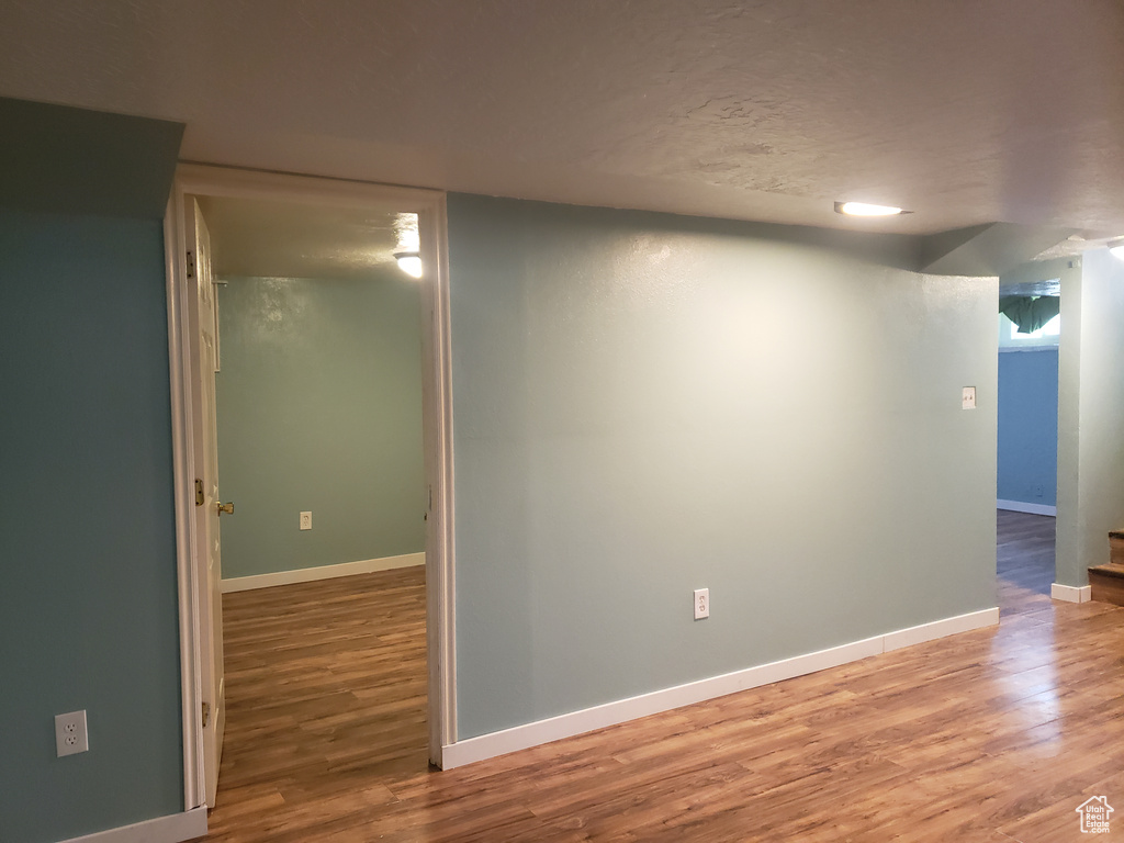 Empty room featuring light wood-style flooring and baseboards