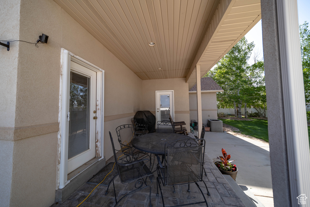 View of patio / terrace featuring outdoor dining space and central AC unit