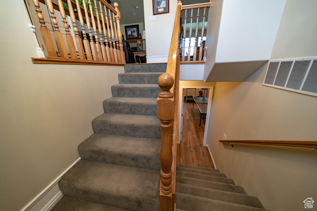 Staircase featuring baseboards
