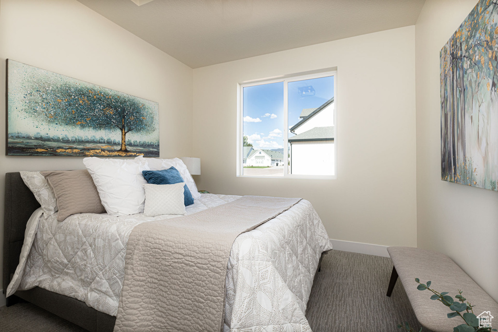 Carpeted bedroom with baseboards