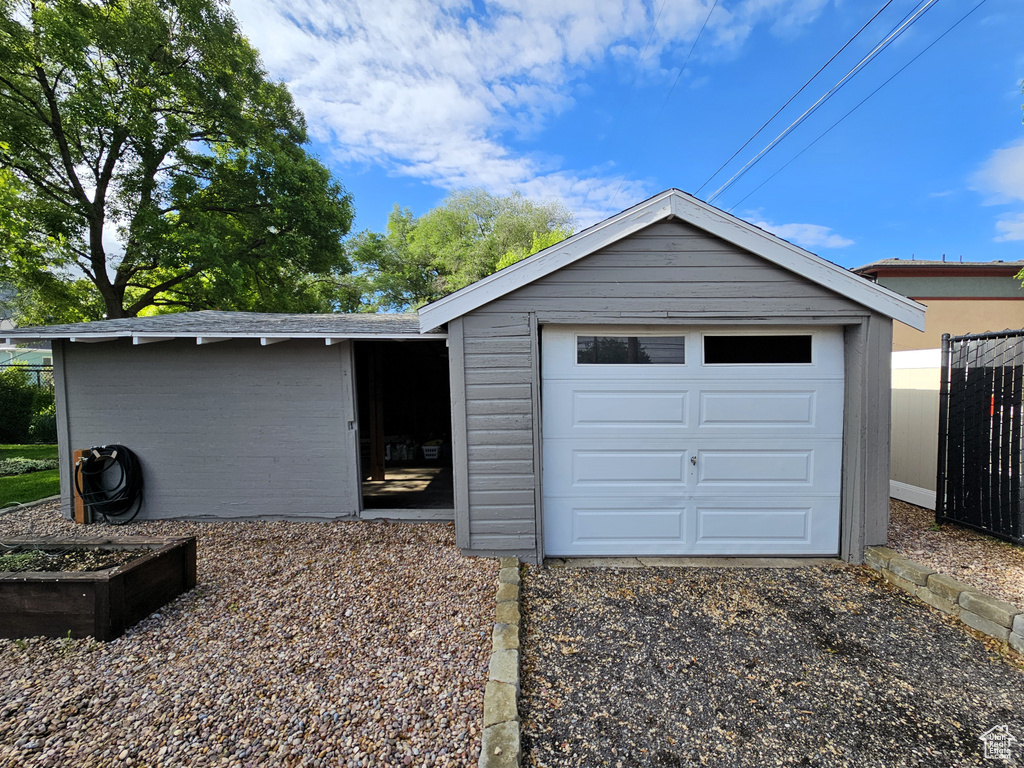 Garage featuring fence
