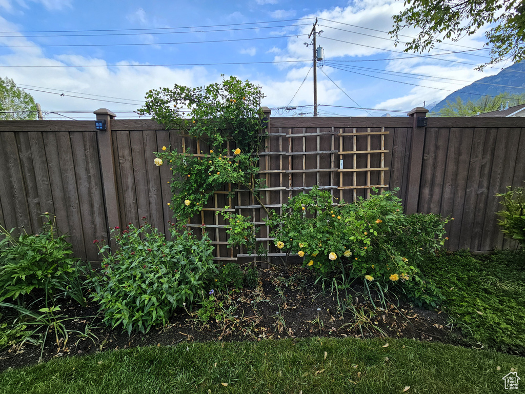 View of yard featuring fence