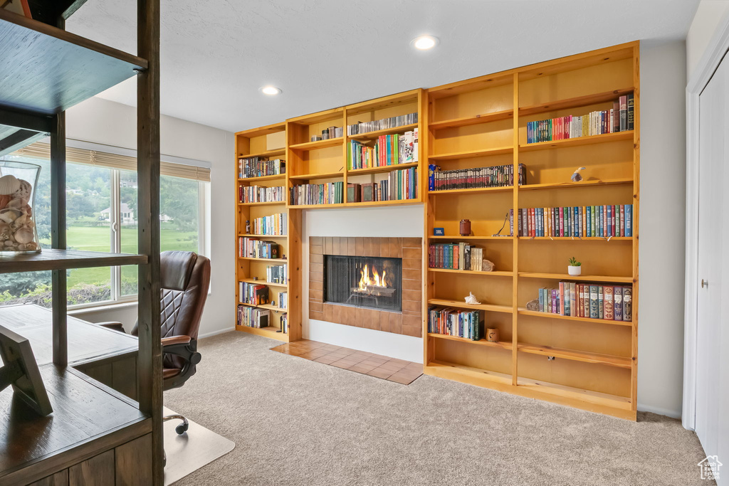 Carpeted office with a fireplace with flush hearth, recessed lighting, and baseboards