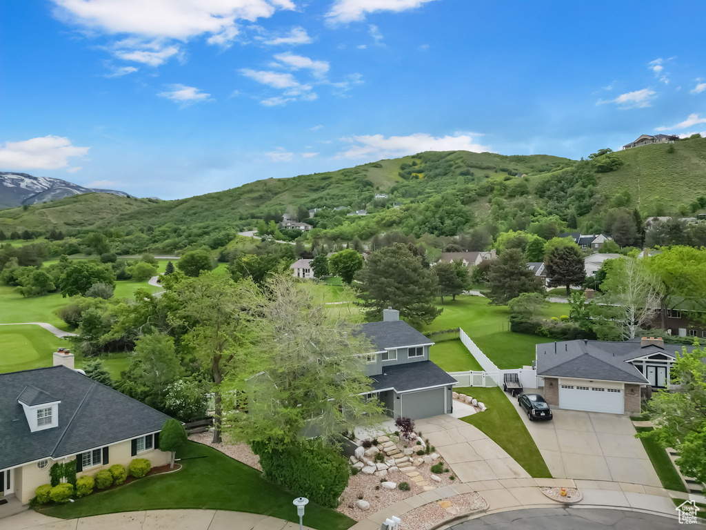Aerial perspective of suburban area with a mountain backdrop