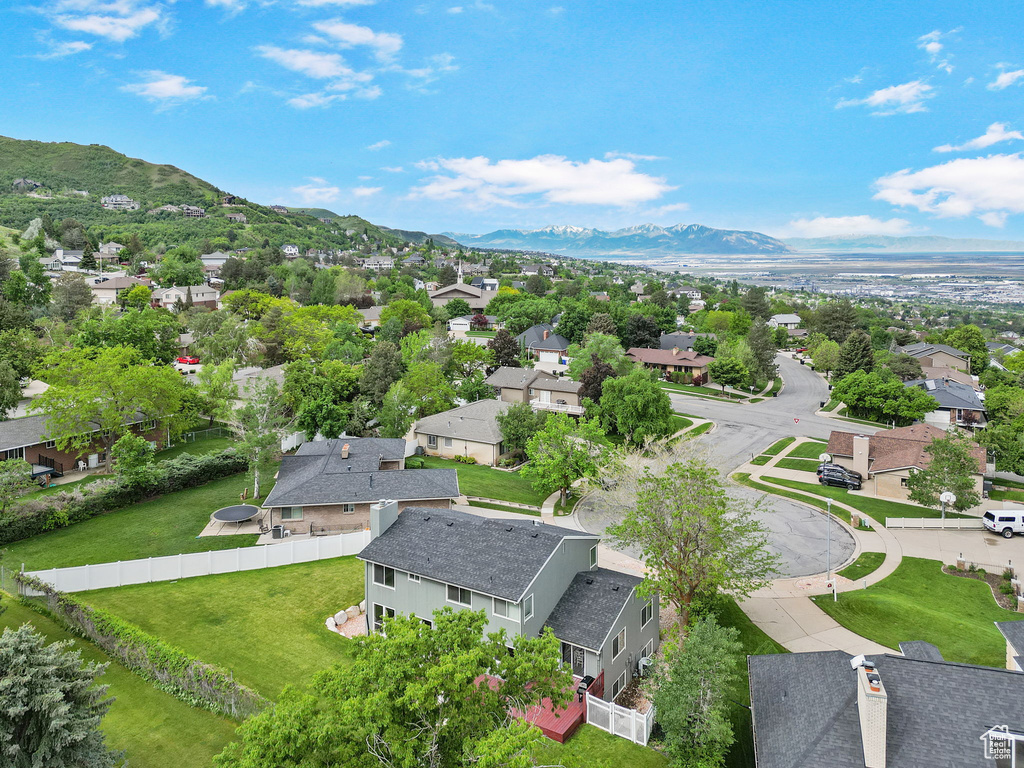 Aerial view of residential area featuring mountains