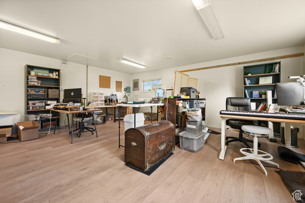Home office featuring light wood-style flooring