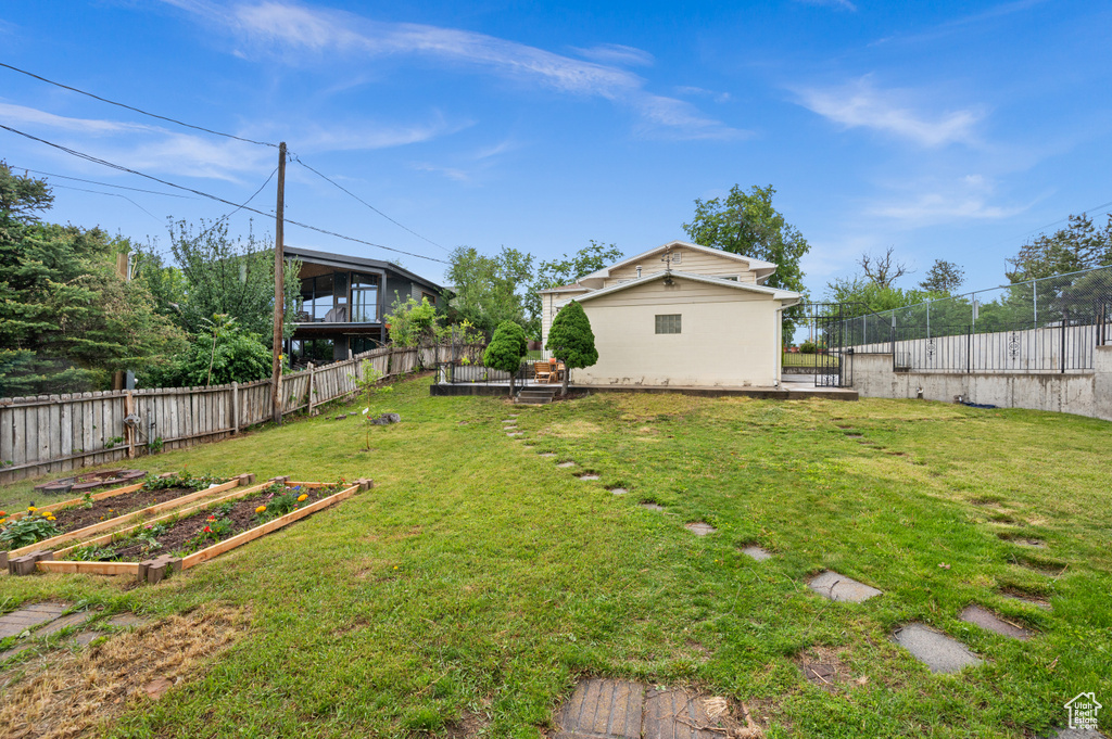 View of yard featuring a vegetable garden