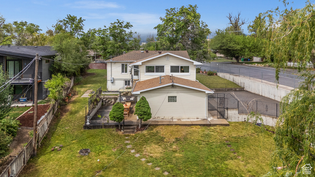Rear view of property with a deck and stairway