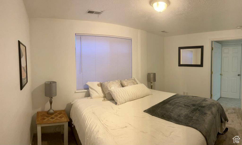Bedroom with carpet flooring