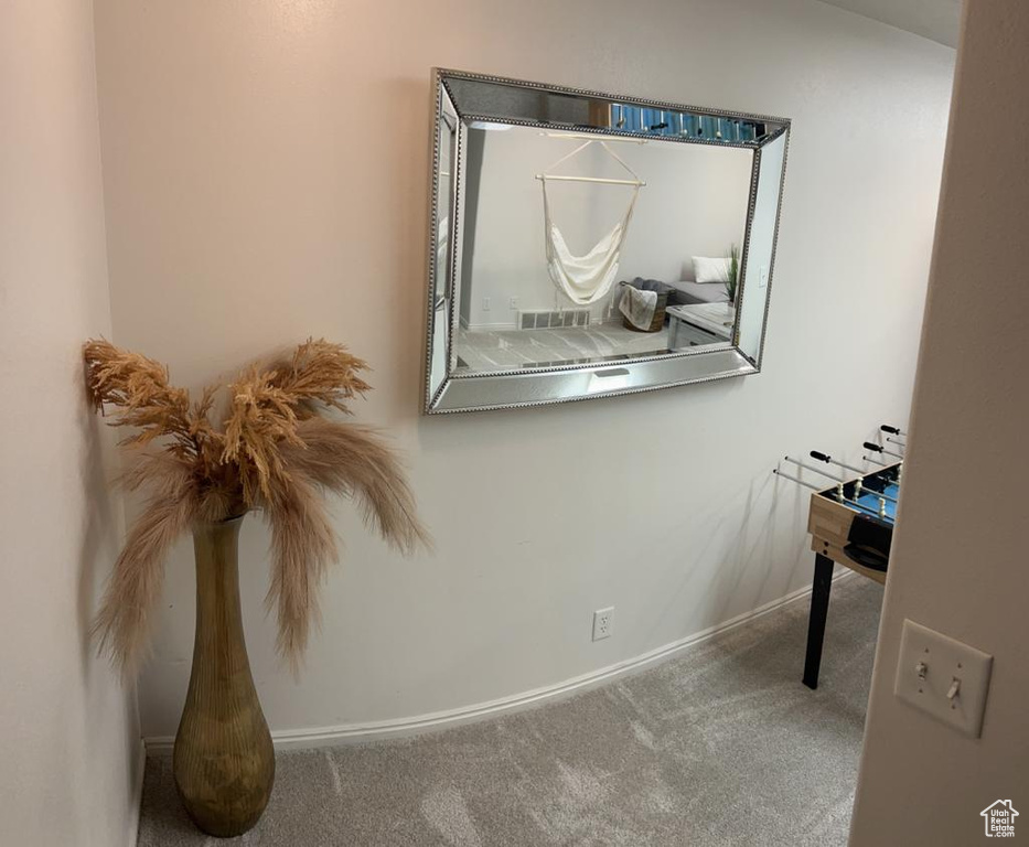 Detailed view of carpet floors and baseboards