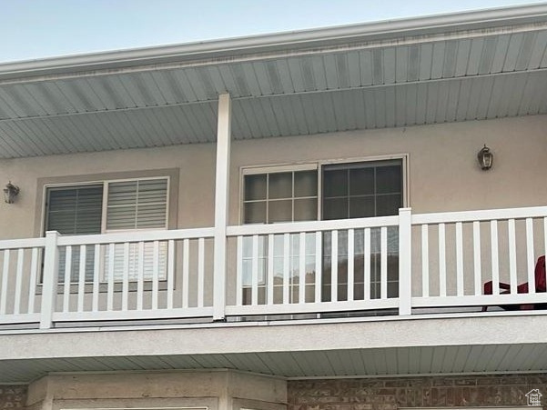 View of property exterior featuring a balcony and stucco siding