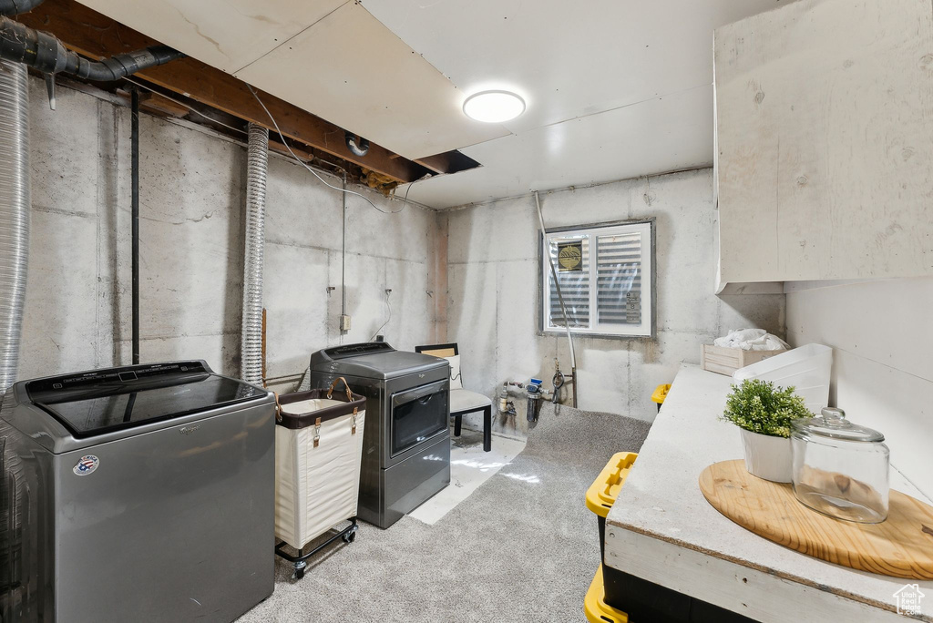 Unfinished basement featuring washer and dryer