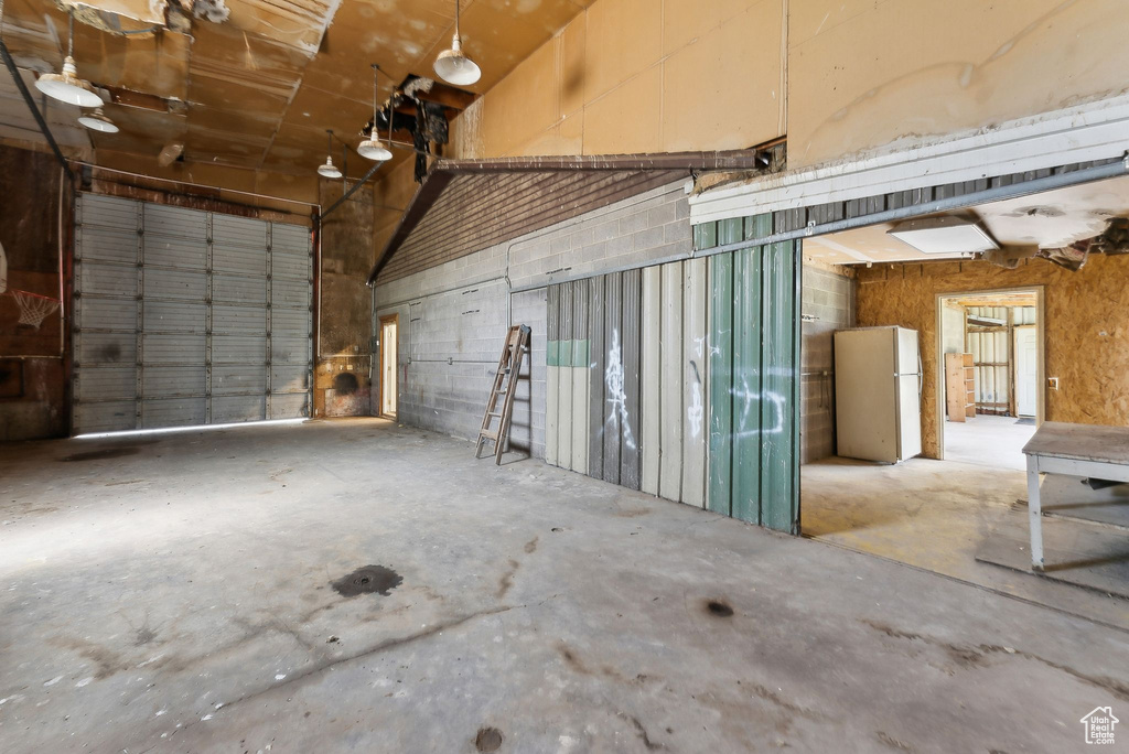 Garage with freestanding refrigerator