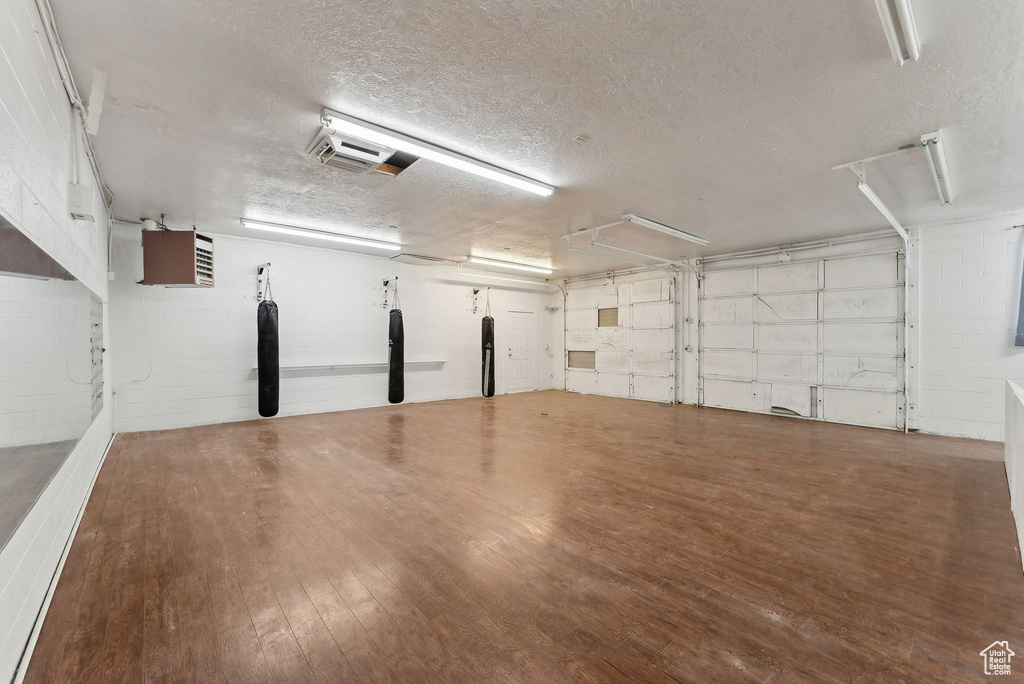 Garage featuring concrete block wall