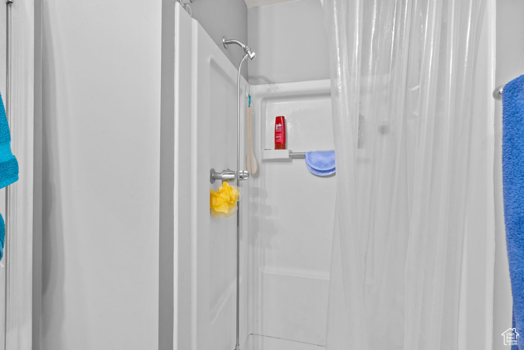 Full bathroom featuring a stall shower