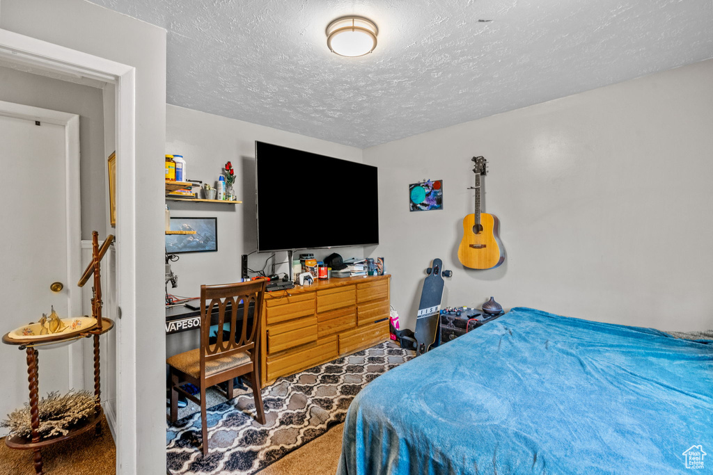 Bedroom featuring a textured ceiling