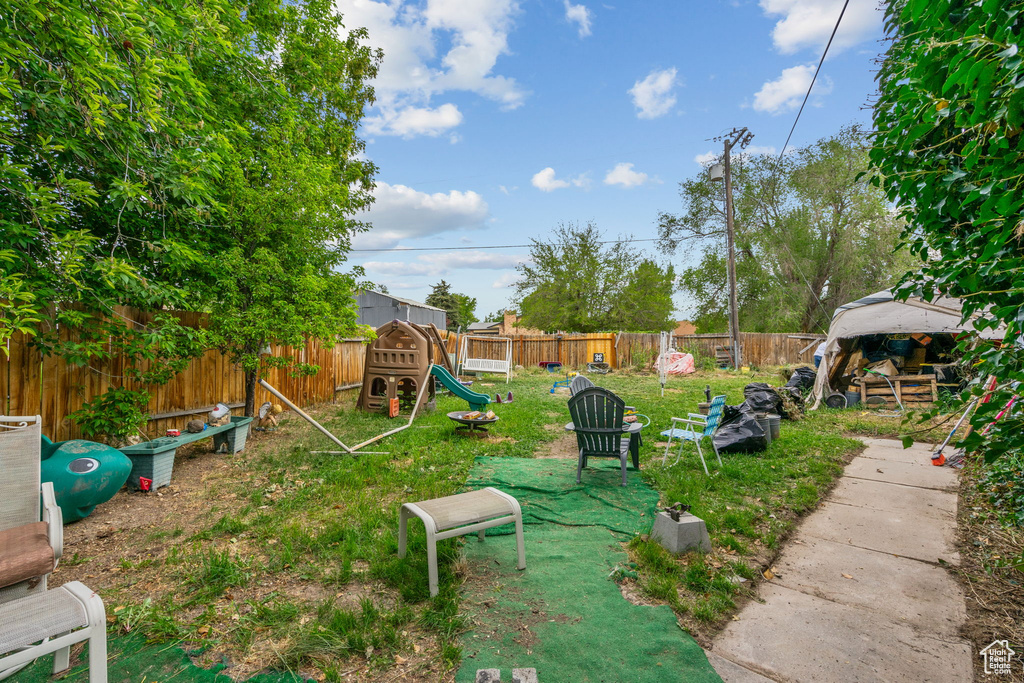 View of yard featuring a playground