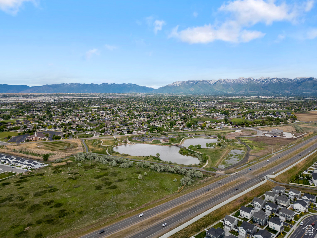 Aerial view of residential area featuring a water and mountain view