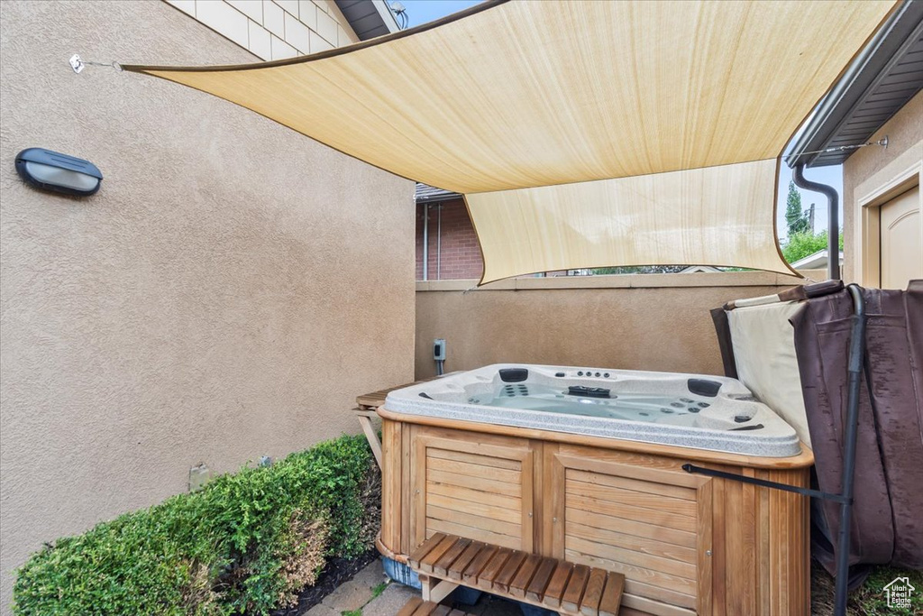 View of patio featuring a hot tub