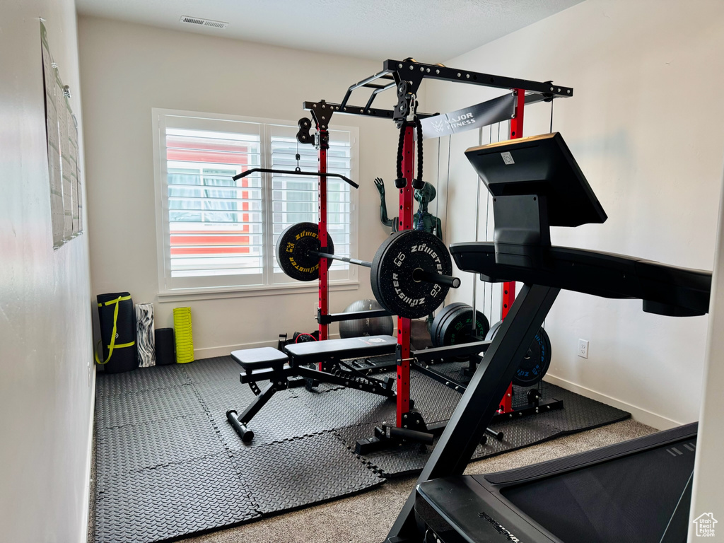 Exercise room featuring baseboards