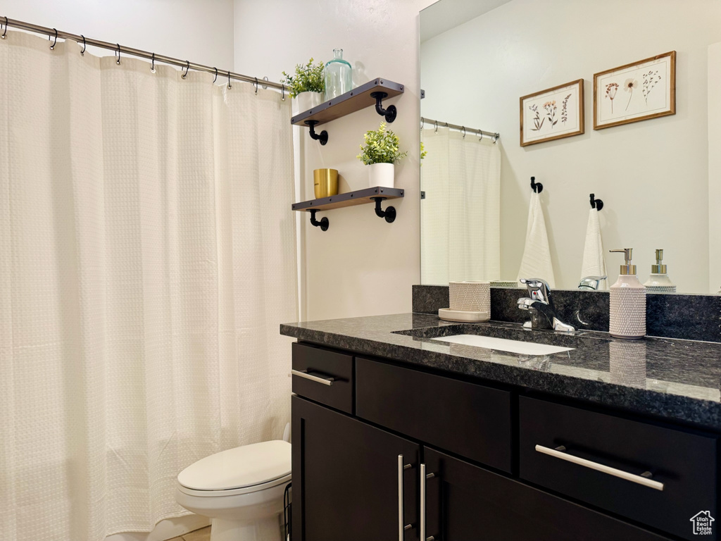 Full bath with toilet and vanity