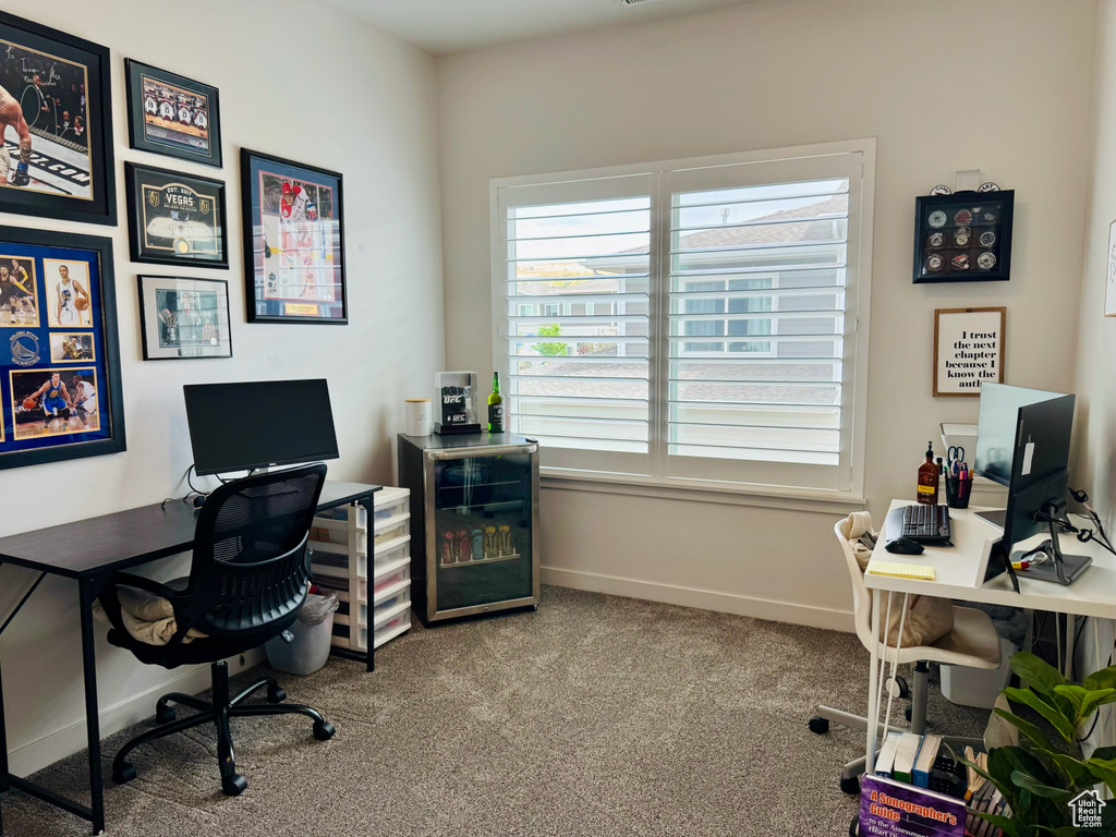 Office featuring healthy amount of natural light, carpet flooring, and baseboards