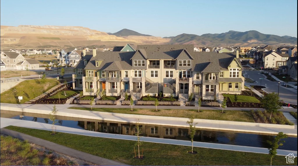 Rear view of house featuring a residential view and a mountain view