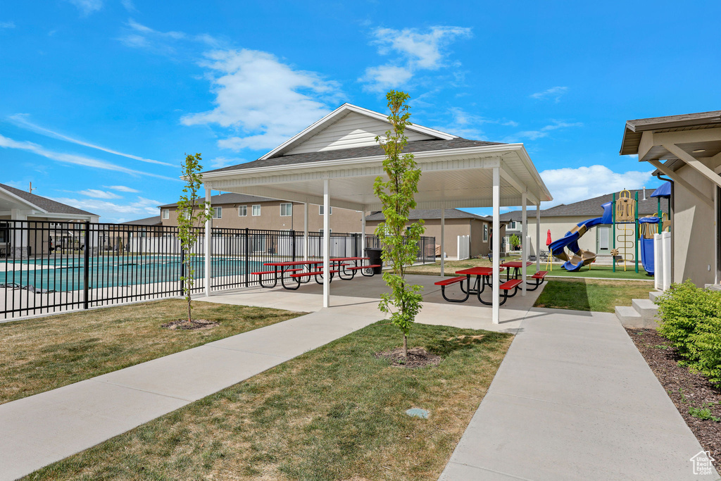 View of property's community with a swimming pool