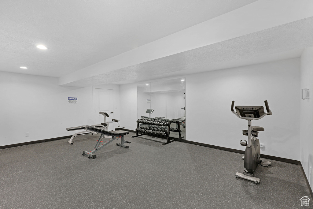 Exercise area with baseboards and recessed lighting
