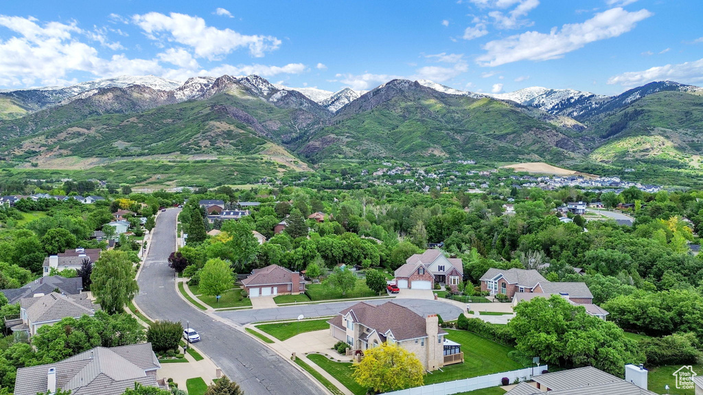 Aerial perspective of suburban area with a mountain backdrop