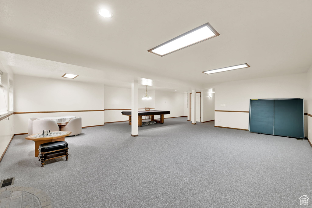 Recreation room with carpet flooring, baseboards, and billiards