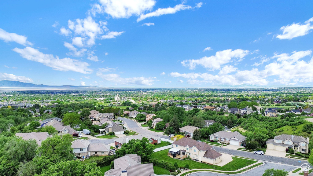 Aerial perspective of suburban area with a mountain backdrop