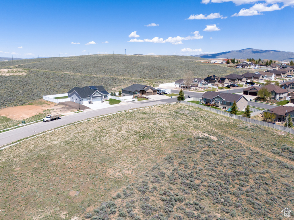 Aerial perspective of suburban area with a mountain backdrop