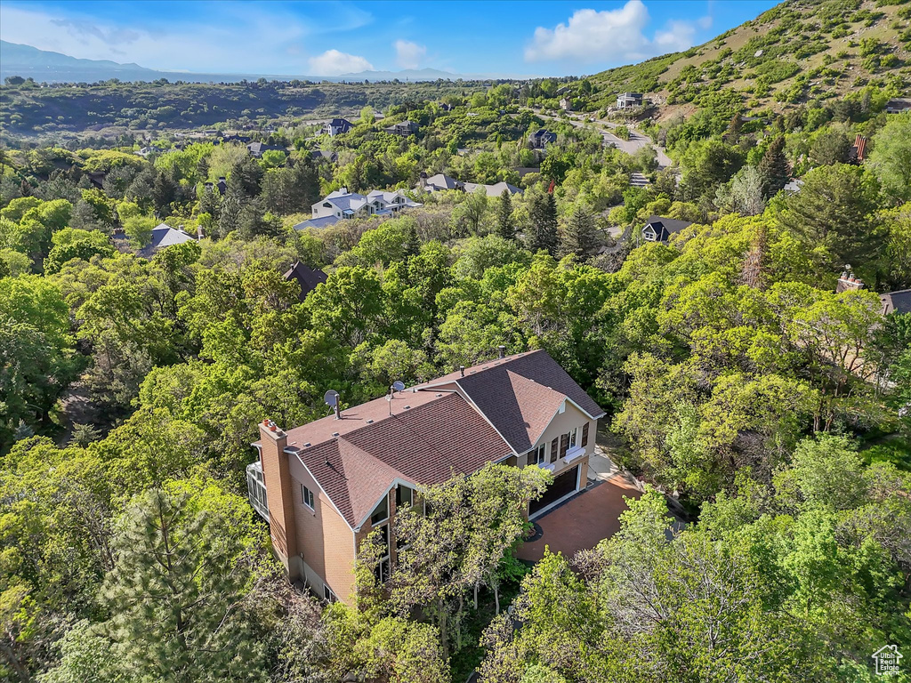 View of subject property with a heavily wooded area
