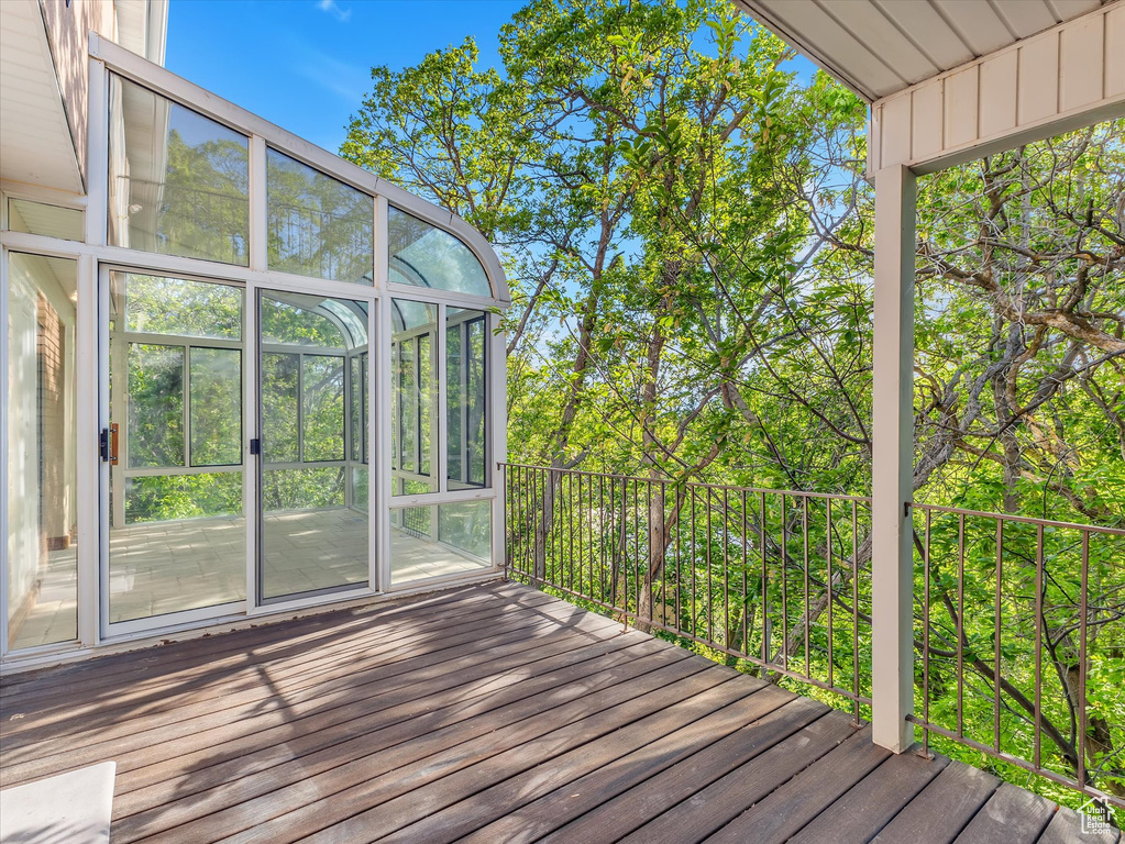 Wooden deck with a sunroom