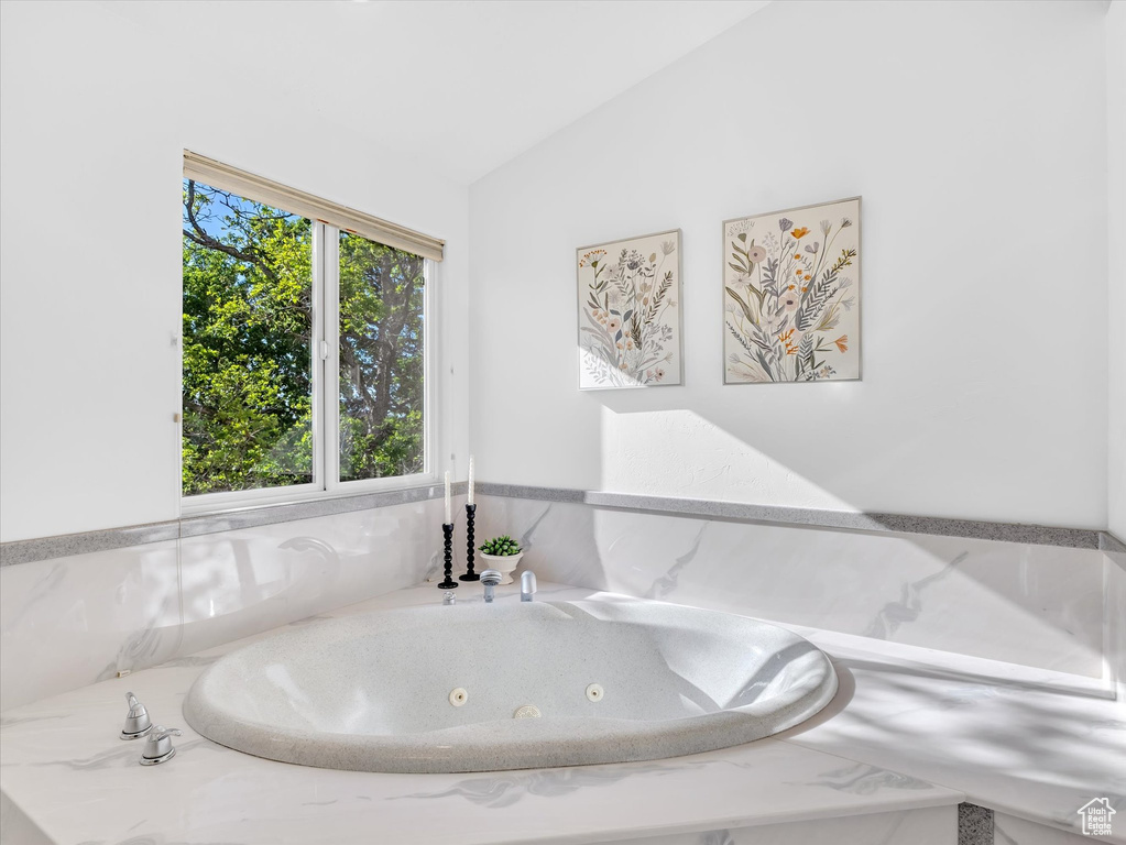 Bathroom featuring lofted ceiling