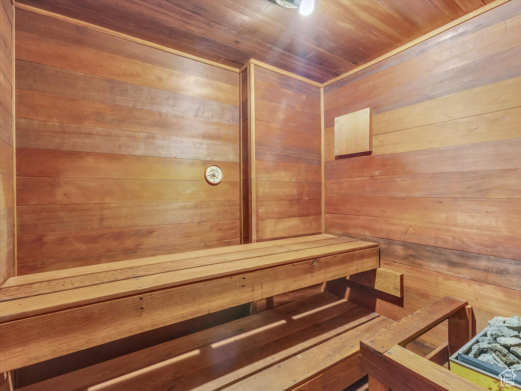 Relaxing sauna featuring wooden walls
