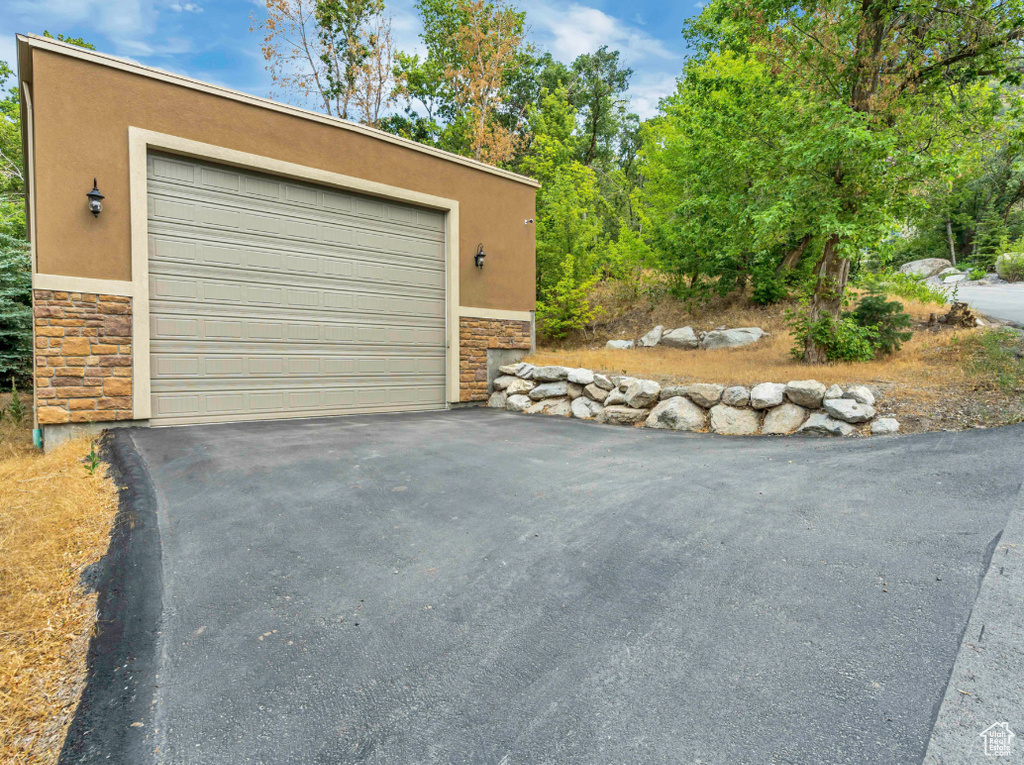 Garage featuring driveway