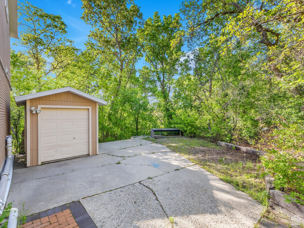 Detached garage featuring driveway