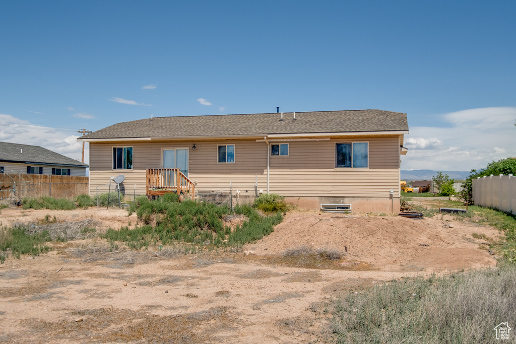 Back of house featuring fence