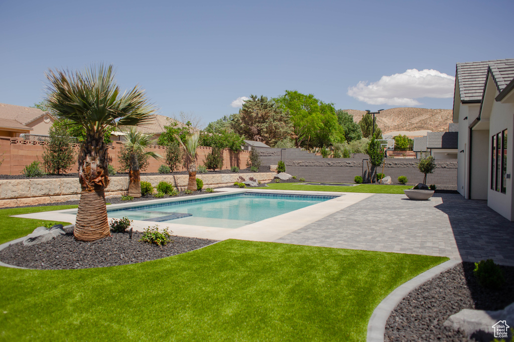 View of pool featuring a patio area and a mountain view