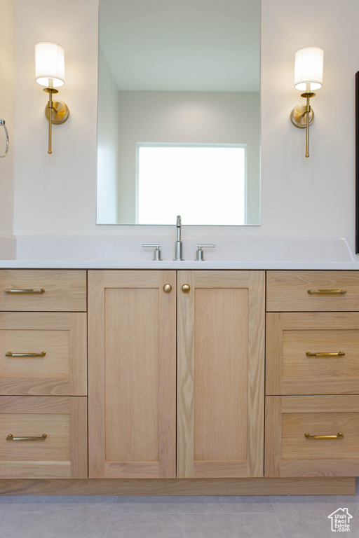 Bathroom with a sink and tile patterned flooring