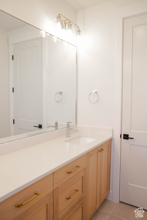 Bathroom with vanity and tile patterned floors