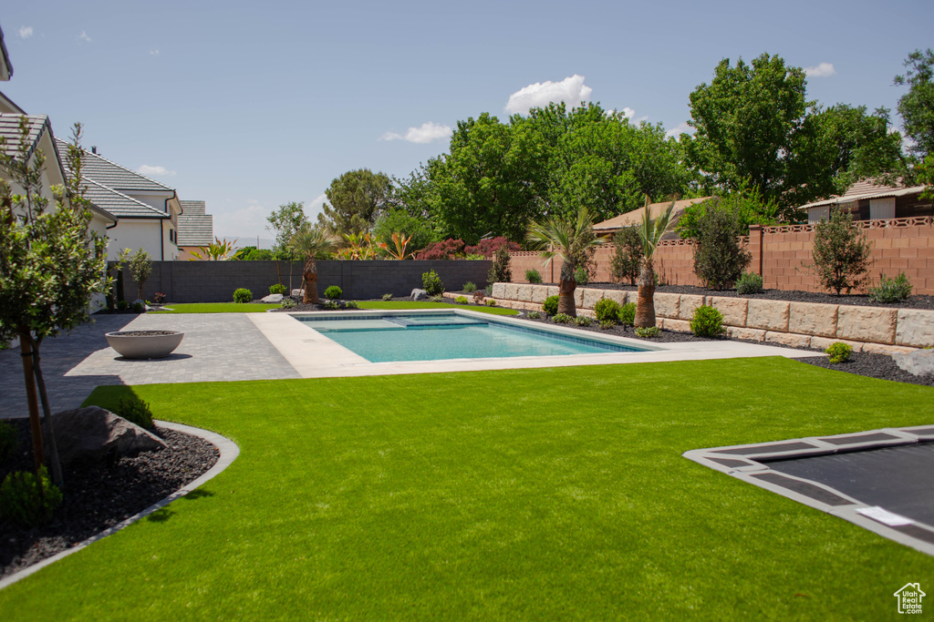 View of swimming pool with a patio